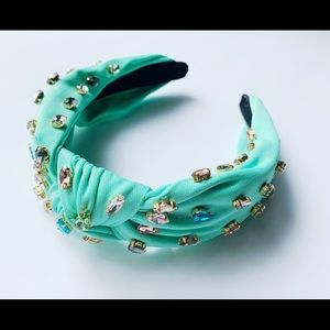 Turquoise material headband with colorful crystals